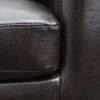 Tub Chair - Dark Brown upholstery close up.